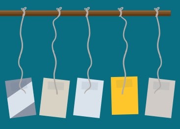 Paper hanging by string